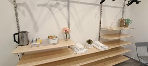 a room with wooden shelves with items on them at Casa di Nonna Margherita in Trecase