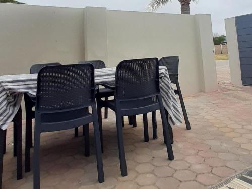 a table and chairs sitting on a patio at 22 on Port Natal Hartenbos in Hartenbos