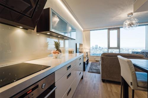 a kitchen with a sink and a counter top at Luxurious, Skyline View Apartment near Centre in Tallinn