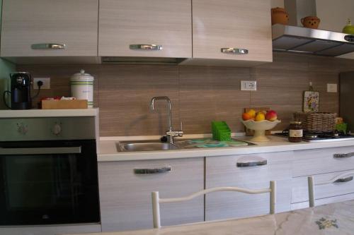 a kitchen with a sink and a counter top at Casa Vacanze Podere San Giusto Volterra in Volterra