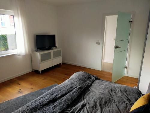 Kama o mga kama sa kuwarto sa Modernes Appartement am Eskesberg