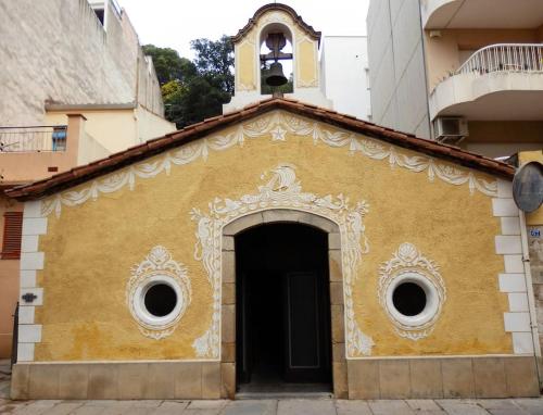 a yellow building with a bell tower on top of it at Apartamento Blanes playa (Costa Brava) in Blanes