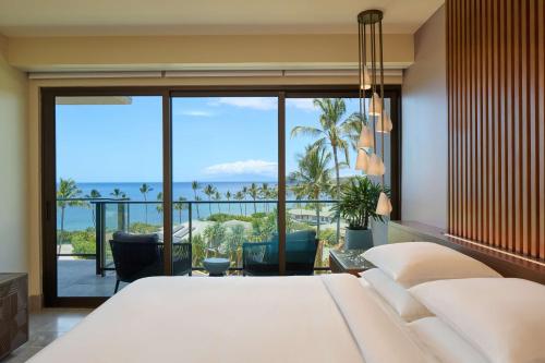 a bedroom with a bed and a view of the ocean at Andaz Maui at Wailea Resort - A Concept by Hyatt in Wailea