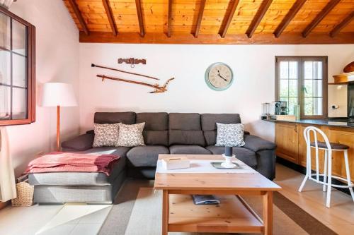 a living room with a couch and a table at Casa Simón in Fátaga