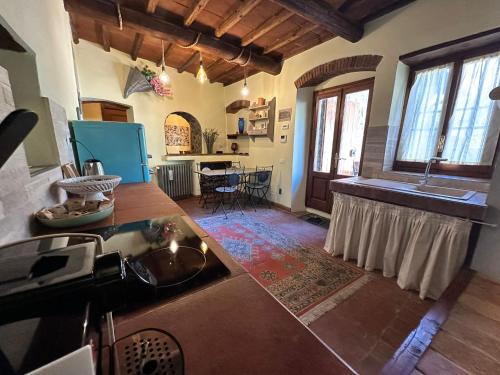 a kitchen with a sink and a counter top at Agriturismo Tassinaia in Pontassieve