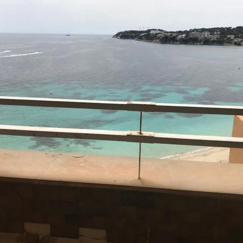 a view of the ocean from a balcony at APARTMENT MAGALUF in Torrenova