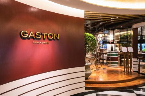 a fashion store with a sign on the wall at Grand Hyatt Erawan Bangkok in Bangkok