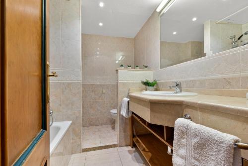 a bathroom with a sink and a shower at Solana Fuengirola 40 in Fuengirola
