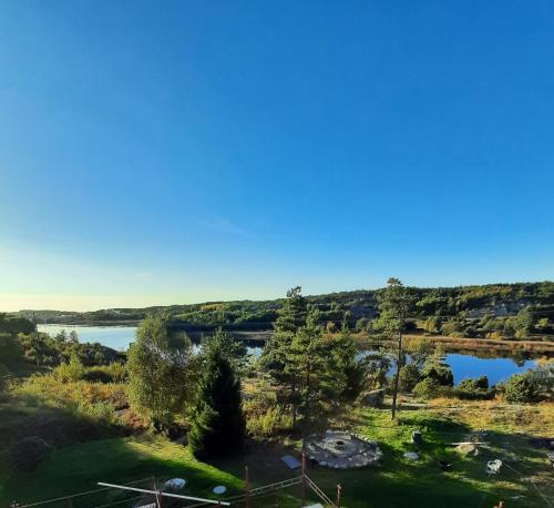 a view of a lake from the top of a hill at Guesthouse Erlandseröd in Strömstad