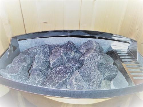a pile of rocks in a pan on a stove at Hotel For You in Olbia