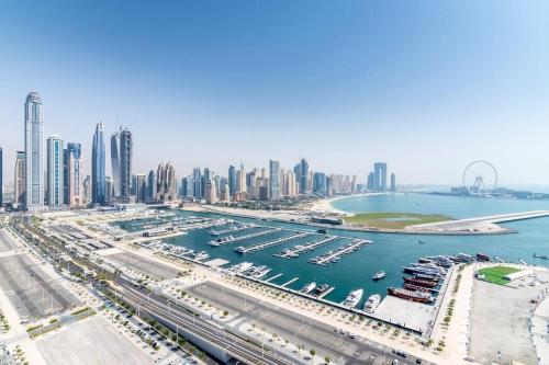 an aerial view of a harbor with a city at Marina Skyline View & Dubai Harbour Beachfront in Dubai