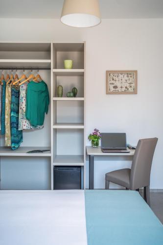 an office with a closet with a desk and a laptop at Villa La Pagaia Sorrento Coast in Vico Equense