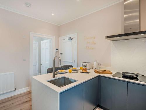 a kitchen with a sink and a counter top at 1 Bed in Earls Colne 92614 in Earls Colne