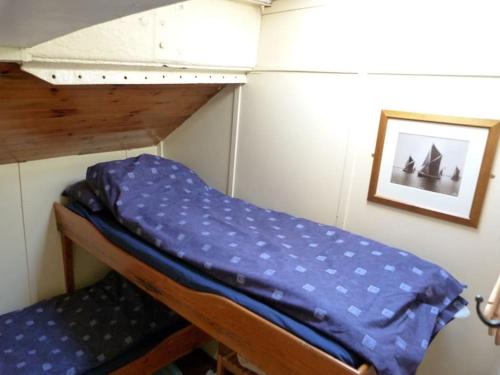 a couple of bunk beds in a small room at Sailing Barge Reminder in Maldon