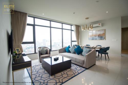 a living room with a couch and a table at PAVILION EMBASSY KLCC By ELITE HOST in Kuala Lumpur