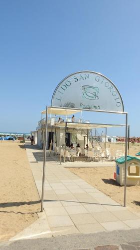 a building on the beach with a sign on it at Hotel San Giorgio in Vasto
