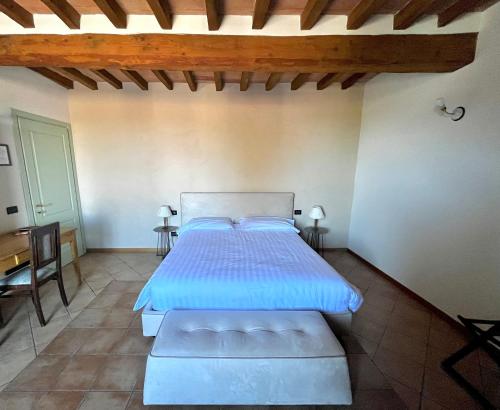 Ένα ή περισσότερα κρεβάτια σε δωμάτιο στο Agriturismo San Giuseppe