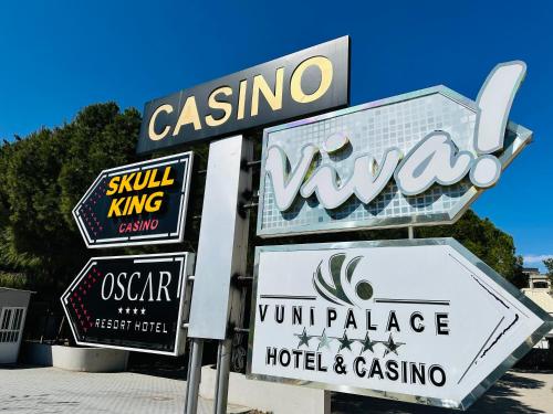 a sign for a hotel and casino at North Residence Deniz Manzaralı Daire in Kérynia