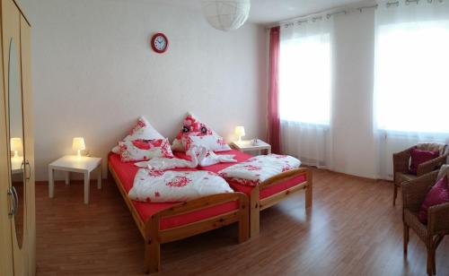 a bedroom with a bed with pillows on it at Sweet Home in Friedrichshafen