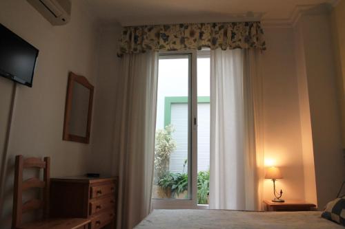Postel nebo postele na pokoji v ubytování Hostal Ana - Adults Recommended