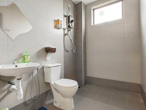 a bathroom with a toilet and a sink at 15-19Pax SemiD Near Highwy W/Pool Table&Karaoke in Ipoh