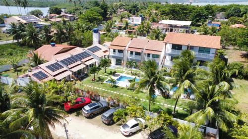 an aerial view of a house with a parking lot at Pousada Villa Minduba in Japaratinga