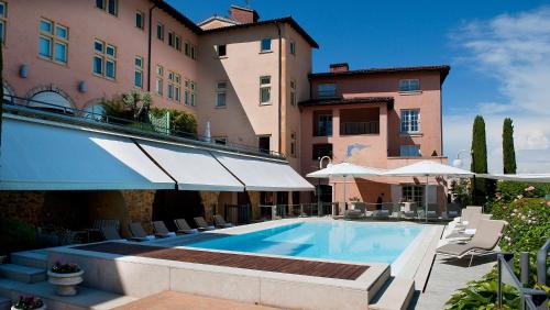 a swimming pool in front of a building at Villa Florentine in Lyon