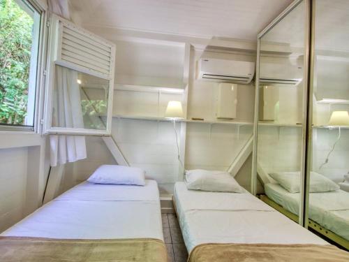 Postel nebo postele na pokoji v ubytování Villa en bord de mer à Saint-Pierre, 100 m²