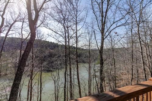 a view of a river from a wooden bridge at Our Neck of the Woods at Hidden Lake in Nebo