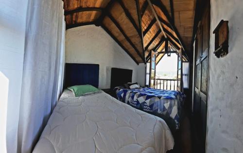 Postel nebo postele na pokoji v ubytování Hostal Oycate
