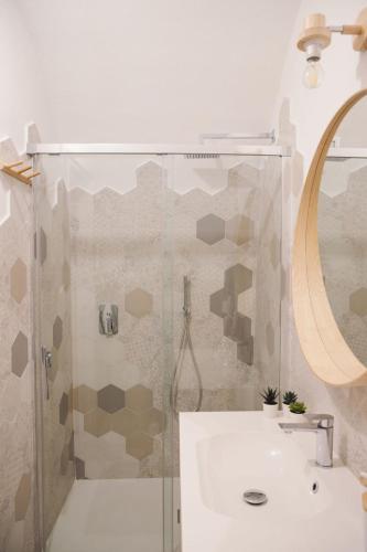 a bathroom with a shower and a sink at Bobboi in Cagliari