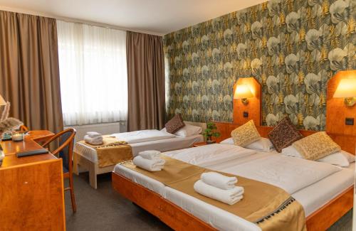 Postel nebo postele na pokoji v ubytování Hotel Rossija