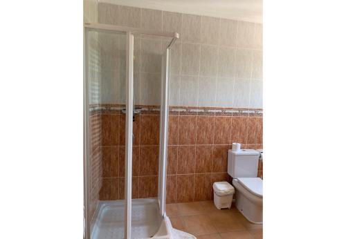 a bathroom with a shower and a toilet at Casa Romero in La Font D´En Carròs