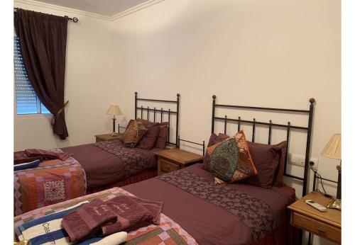 Un pat sau paturi într-o cameră la Casa Romero