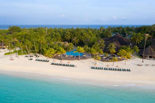 an aerial view of a beach with umbrellas and the ocean at Kuredu Island Resort & Spa in Kuredu