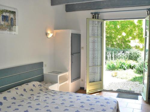 Ένα ή περισσότερα κρεβάτια σε δωμάτιο στο La Ramade 5 Chambres & Table d'hôtes en Drôme Provençale