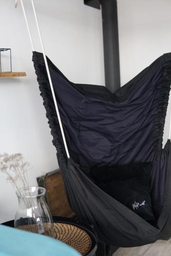 a black umbrella sitting on top of a table at Zlatibor Wild in Zlatibor