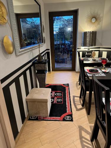 a kitchen and dining room with a table and a box at Residenza Ca' degli Enzi in Verona