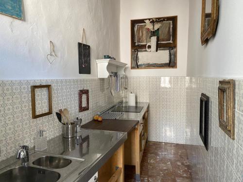 a kitchen with a sink and a counter top at 7.Frecavalli Appartamento in Palazzo d'epoca in Crema