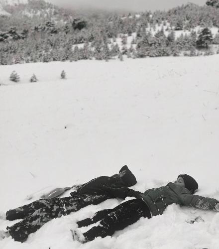 a person is laying in the snow at Zlatibor Wild in Zlatibor