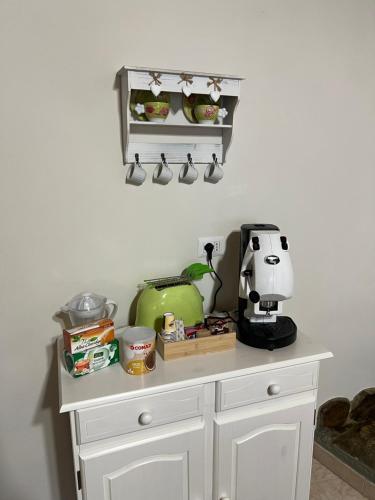 a kitchen counter with a coffee maker on it at Casa Belvedere Motta Camastra Gole Alcantara in Motta Camastra