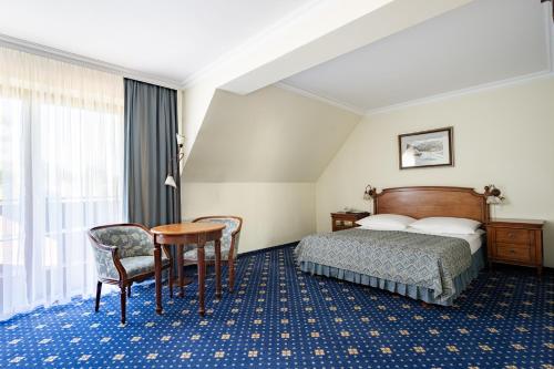 Postel nebo postele na pokoji v ubytování Hotel Belvedere Resort&SPA