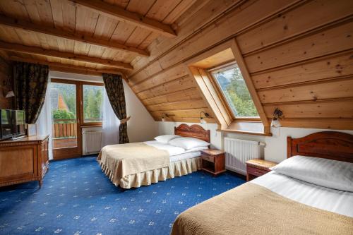 Postel nebo postele na pokoji v ubytování Hotel Belvedere Resort&SPA