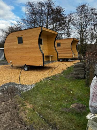 two large wooden trailers parked in a yard at Strandgut Kajüte in Cuxhaven