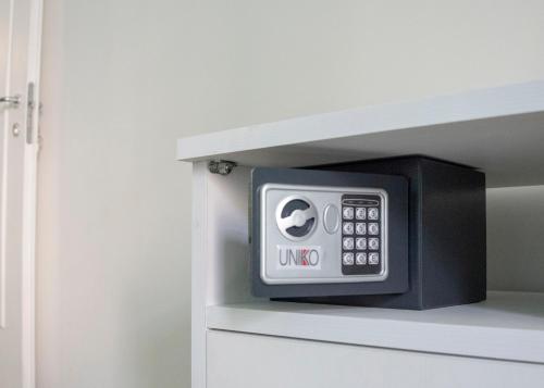 a microwave oven sitting inside of a cabinet at Reginella Guest House in Salerno