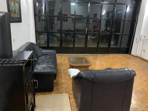 a living room with a couch and a table at SSHC Apartments in Addis Ababa