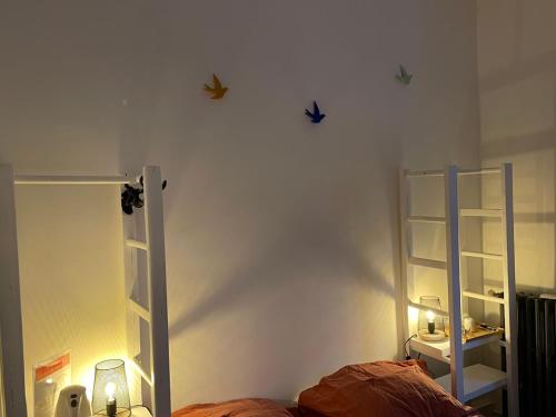 a bedroom with two bunk beds and two shelves at Hôtel La Villa Patricia - Charme et Tradition in Villefranche-sur-Mer