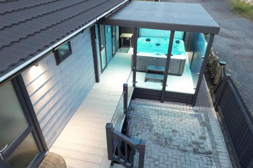 an overhead view of a house with a swimming pool at Arranview Lochside Pods & Lodges all with private Hot-tubs in Fenwick