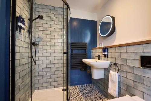 a bathroom with a sink and a shower at Plockton Inn in Plockton