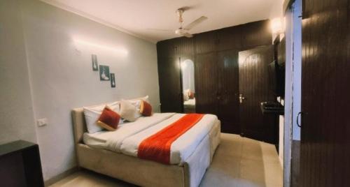 a bedroom with a large bed in a room at Royal galaxy kalkaj in New Delhi